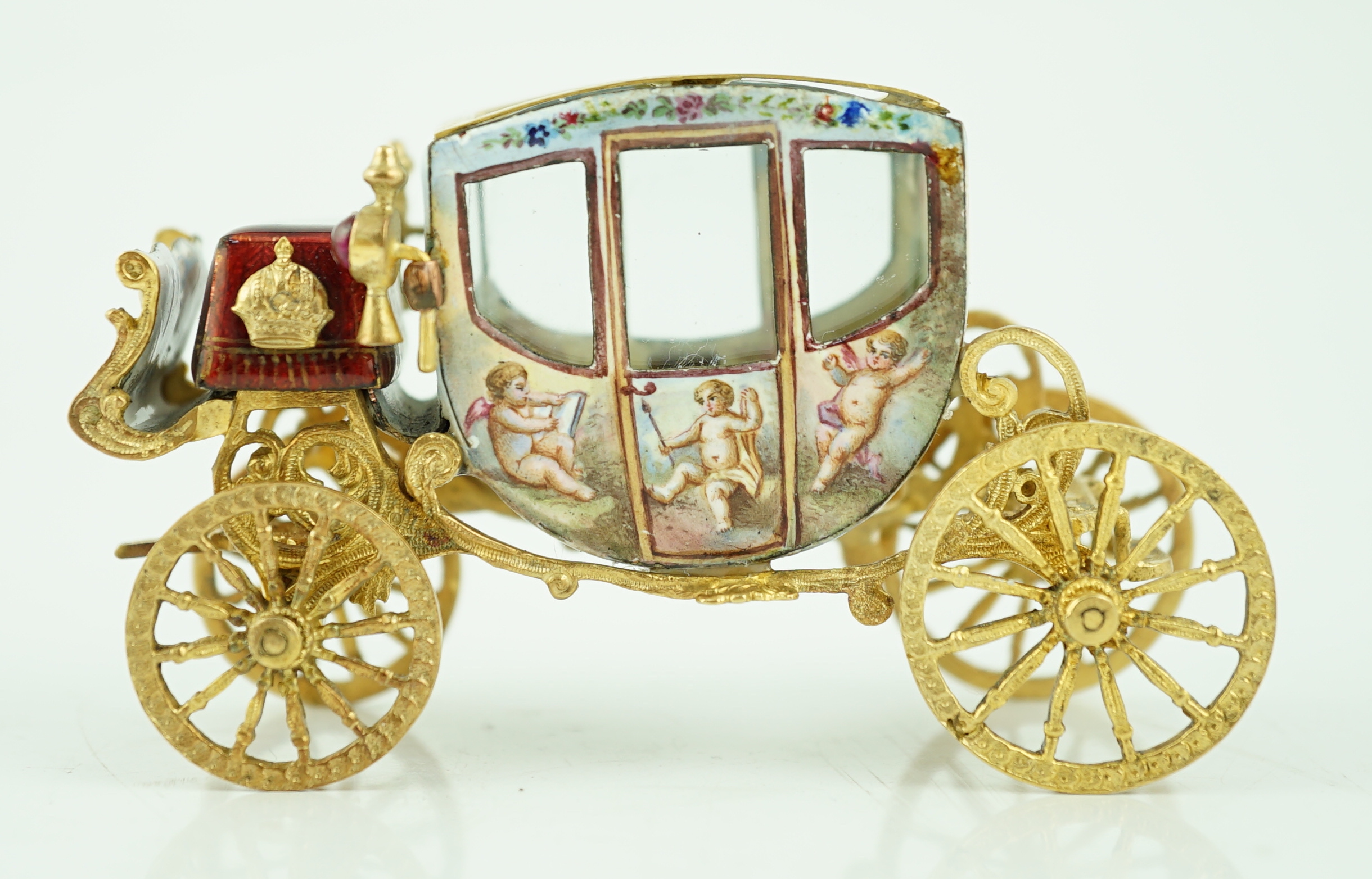 An early 20th century Viennese silver gilt and enamel miniature model of carriage, by Ludwig Pollitzer?